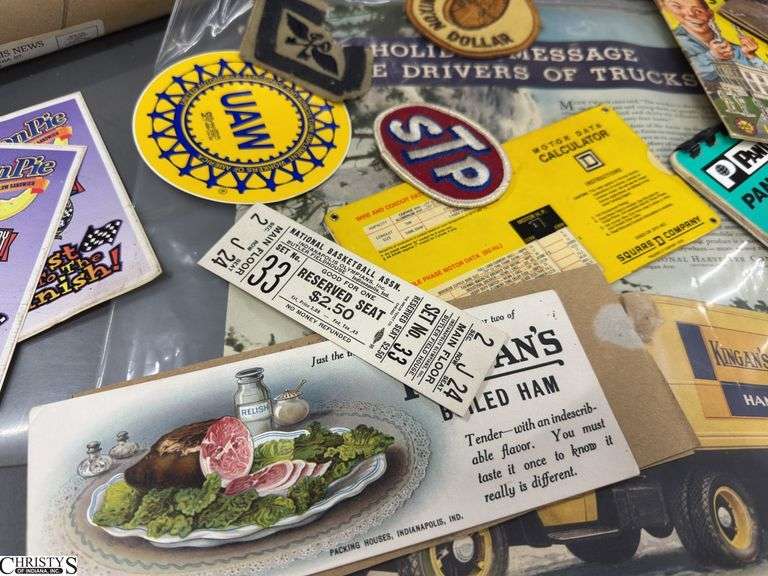 Mixed Lot of Memorabilia to Include a 1949 National Basketball Assn. Indianapolis Olympians, Inc. Butler Fieldhouse Ticket,  a Kingan's Packing Houses, Indpls., IN Boiled Ham Blotter, Motor Data Calclator, Moon Pie and 50th Anniversary of Nascar Sticker, Welcome to Truck & Bus Indpls. Manufacturing Brochures, Louis Marx & Co. American Presidents in Miniature Brochure, an Indianapolis Pacers SEALED Envelope Dated Nov. 20, '67, An Areal Photo of Indianapolis and a Metal Tin Jack Daniels with 2 Shot Glasses