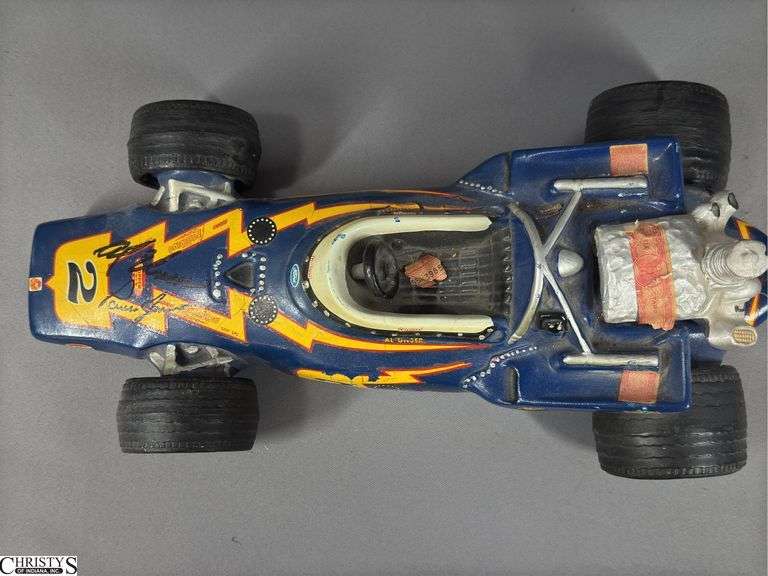 #2 Johnny Lightning Porcelain Lionstone Decanter Autographed by Al Unser and Parnelli Jones.  EMPTY