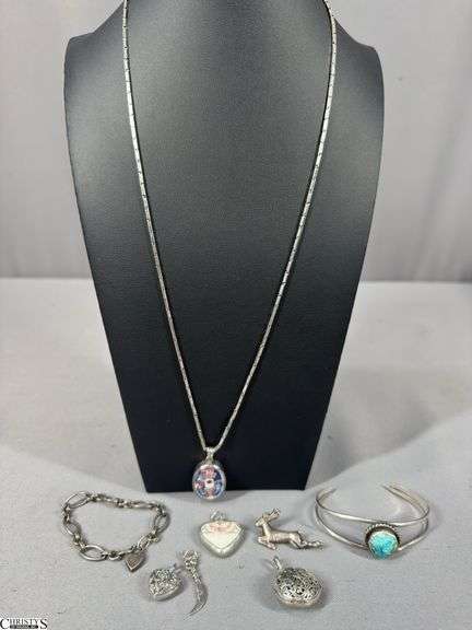 Unmarked Sterling Looking Jewelry.  Includes 1 Chain with Pendant, 2 Bracelets, 4 Pendants and a Pin image