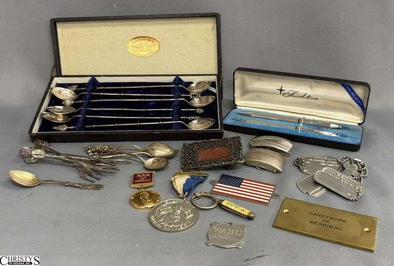 6-Piece Sterling Silver Spoon Set, 1 Small Sterling Spoon, 4 Small Unmarked Silver Color Spoons, 7 Unmarked Cocktail Forks, a Traditions Sterling Silver Pen Set, 2 Sets of Dog Tag Like Pieces, Tiny Pocket Knife, a Soviet Jubilee Medal, and a St. Peter Claver Award of Merit Medal image