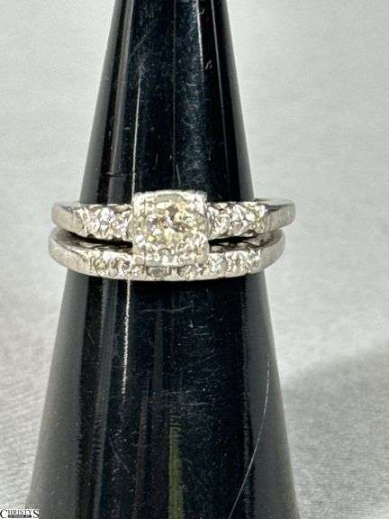 Unmarked 18K White Gold Diamond Wedding Set.  Includes a diamond engagement ring with 1/4 carat diamond and a wedding band with .15 carat of diamonds image
