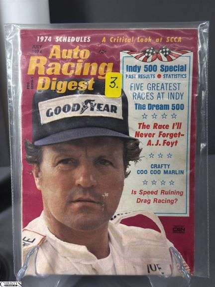 Racing Memorabilia.  Large Legends of Indy Poster, 2 Auto Racing Digest Nov. 1983 and July 1974, Two "First Annual Nascar 400 Indianapolis 1944" Plastic Commemorative Cups, 2 Goodyear Nascar Posters and a 2014 500 Festival Pin