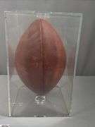 3 Footballs- One Blue NAPA Auto Parts and 2 Wilson National Football League.  One Wilson has autographed but they are fading and can not be read.  The other Wilson ball is in a display case.