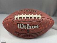 3 Footballs- One Blue NAPA Auto Parts and 2 Wilson National Football League.  One Wilson has autographed but they are fading and can not be read.  The other Wilson ball is in a display case.