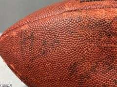 3 Footballs- One Blue NAPA Auto Parts and 2 Wilson National Football League.  One Wilson has autographed but they are fading and can not be read.  The other Wilson ball is in a display case.
