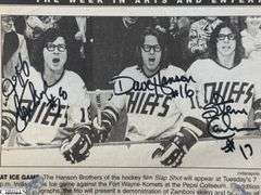 2 Mid-1970's Original Racers Hockey Photos Mounted on Cardboard and "Slap Shot" Memorabilia.  Includes a Hanson Brothers Autographed Photo, Autographed DVD Cover,  Sports Illustrated Slap Shot Autographed Magazine, "Slap Shot" The Book by Richard Woodley Autographed.