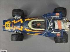 #2 Johnny Lightning Porcelain Lionstone Decanter Autographed by Al Unser and Parnelli Jones.  EMPTY