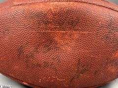 3 Footballs- One Blue NAPA Auto Parts and 2 Wilson National Football League.  One Wilson has autographed but they are fading and can not be read.  The other Wilson ball is in a display case.
