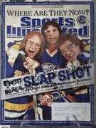 2 Mid-1970's Original Racers Hockey Photos Mounted on Cardboard and "Slap Shot" Memorabilia.  Includes a Hanson Brothers Autographed Photo, Autographed DVD Cover,  Sports Illustrated Slap Shot Autographed Magazine, "Slap Shot" The Book by Richard Woodley Autographed.