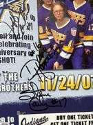 2 Mid-1970's Original Racers Hockey Photos Mounted on Cardboard and "Slap Shot" Memorabilia.  Includes a Hanson Brothers Autographed Photo, Autographed DVD Cover,  Sports Illustrated Slap Shot Autographed Magazine, "Slap Shot" The Book by Richard Woodley Autographed.