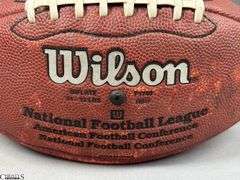 3 Footballs- One Blue NAPA Auto Parts and 2 Wilson National Football League.  One Wilson has autographed but they are fading and can not be read.  The other Wilson ball is in a display case.