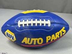3 Footballs- One Blue NAPA Auto Parts and 2 Wilson National Football League.  One Wilson has autographed but they are fading and can not be read.  The other Wilson ball is in a display case.