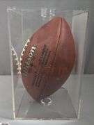 3 Footballs- One Blue NAPA Auto Parts and 2 Wilson National Football League.  One Wilson has autographed but they are fading and can not be read.  The other Wilson ball is in a display case.