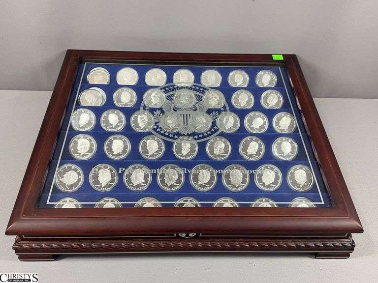 U.S. Presidential Silver Commemoratives 44 Piece Set in Glass Top Display Case.  Each Pieces is 1 Troy Ounce .999 Fine Silver.  Also includes a Certificate of Registration from The Danbury Mint.  19" X 17" X 4 1/2" image