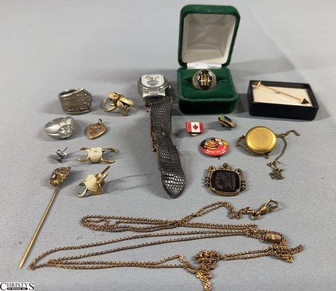 Misc. Jewelry- Includes an Unmarked Diamond Lion Head Stick Pin (eyes look to be ruby), a Sterling Silver "W" Ring, 2 Dental Bridges, a Tiny Sterling Guitar Shaped Earring, USAC Member Pin, 3 Unmarked Rings, Philip Stein Teslar Watch (band is damaged) and More. image