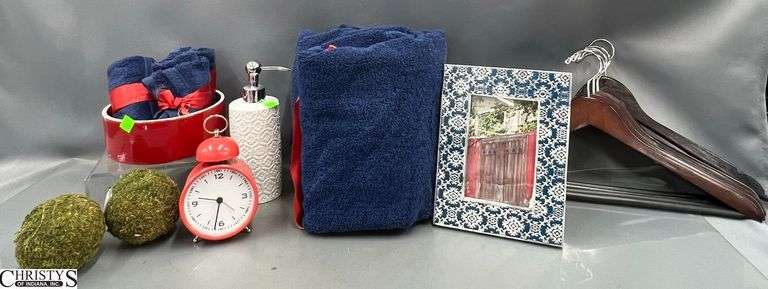 Navy Hand Towels, Alarm Clock, Hand Soap, Wood Hangers, Frame, Moss Balls image