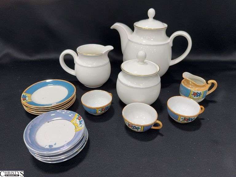 a White Teapot, Creamer & Sugar Marked Made in England and Miniature Dishes Marked Made in Japan (some of these pieces are chipped) that includes 5 Plates, 1 Pitcher, 3 Tea Cups and 5 Saucers image