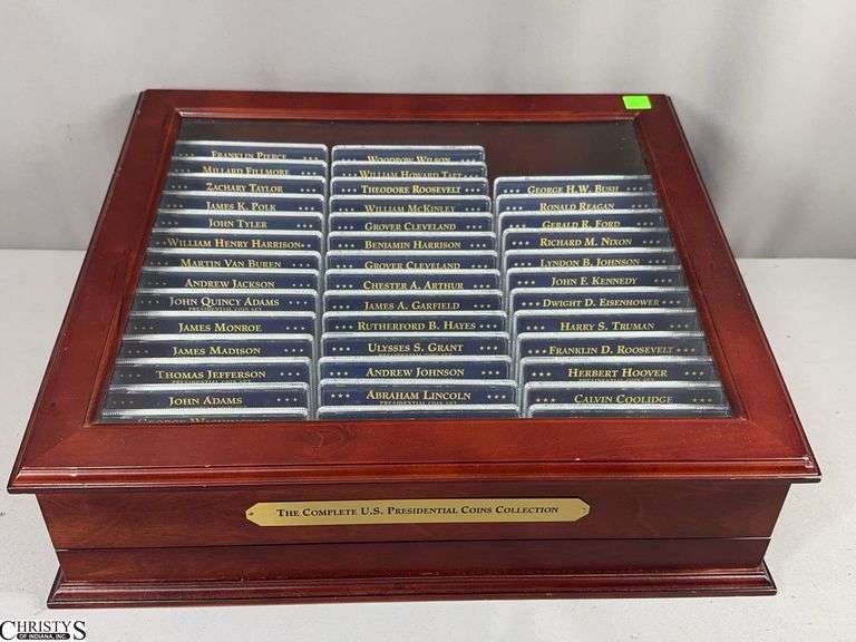 The Complete U.S. Presidential Coins Collection 40-Piece Set in a Glass Top Display.  Each set includes a 3-Piece Presidential $1 Coin Set image