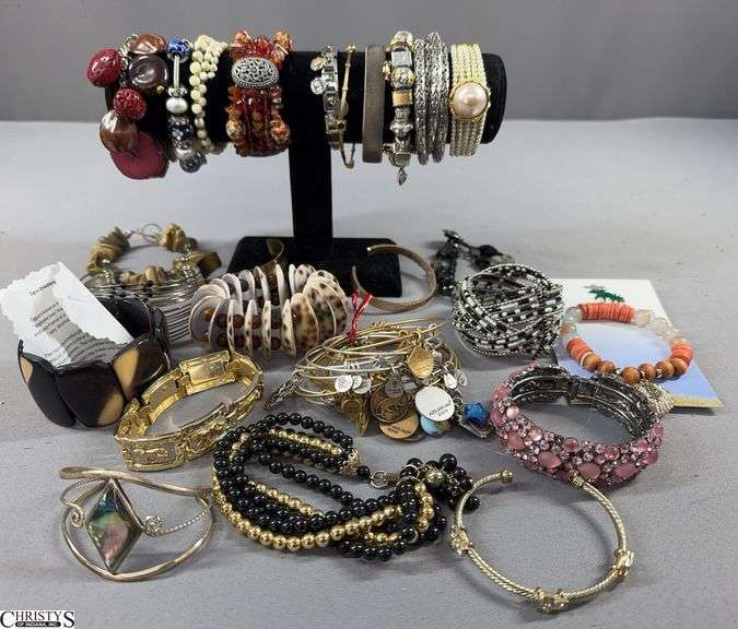 25 Bracelets Including 1 with a Paper Marked Tagua Bracelets - from the rainforest and 1 Marked Alex and Ani image