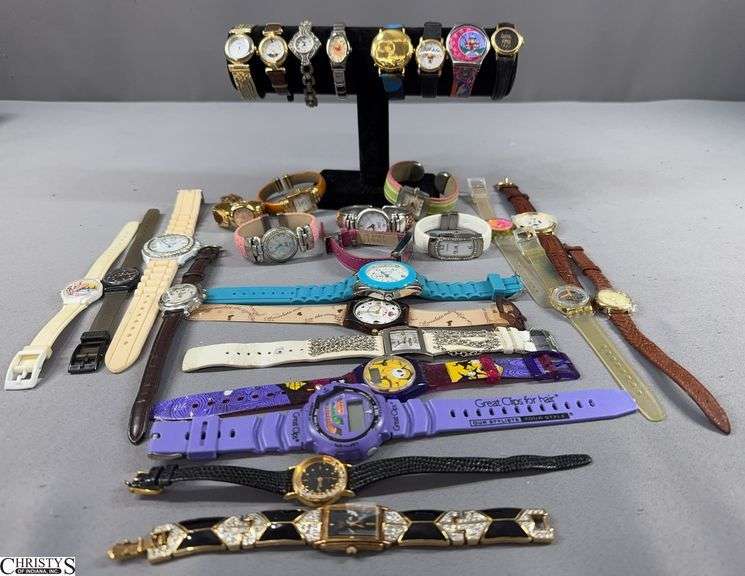 30 Wrist Watches.  Includes Brittania, Faberge, J. Jill, Mudd, Hershey's, Gossip, Geneva, Kodak and More.  There are a few that need some repair. image