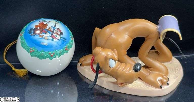 Walt Disney Classics Collection from Beach Picnic is Pluto "Sticky Situation" Sculpture in Box with Certificate of Authenticity and 2000 Pluto's Christmas Tree Ornament in Box with Certificate of Authenticity. image