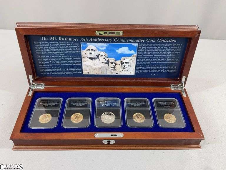 The Mt. Rushmore 75th Anniversary Commemorative Coin Collection in Wood Display Box.  Includes 1 Proof Half Dollar and 4 Never-Circulated Presidential Dollars image