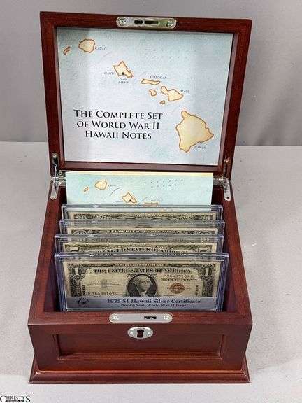 The Complete Set of World War II Hawaii Notes in a Wood Display Box with Key.  Includes a 1934 $20 Hawaii Federal Reserve Note Brown Seal, a 1934 $10 Hawaii Federal Reserve Note Brown Seal, a 1934 $5 Hawaii Federal Reserve Note Brown Seal and a 1935 $1 Hawaii Federal Reserve Note Brown Seal.  One of the hinges on the box needs repair. image