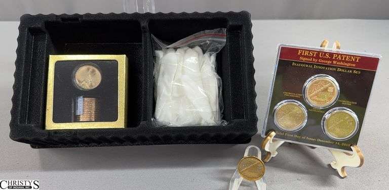 Golden Dollars Celebrating The Spirit of American Innovation in Box.  Includes 13 Dollar Coins (12 never circulated coins in a tube sealed by the Danbury Mint) and a First U.S. Patent Inaugural Innovation Dollar Set,  and a  American Innovators $1 Coin image
