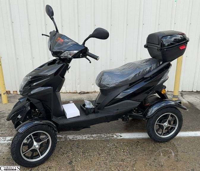 4 Wheel Scooter Electric with Charger. We Put This Together It Came In a Crate. From a Local Estate image