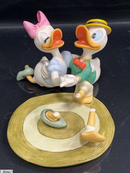 Walt Disney Classics Collection from Mr. Duck Steps Out is Donald and Daisy "Oh Boy, What a Jitterbug!" Sculpture in  Box.  This sculpture is broken but can be glued back together cleanly.  See Photos image