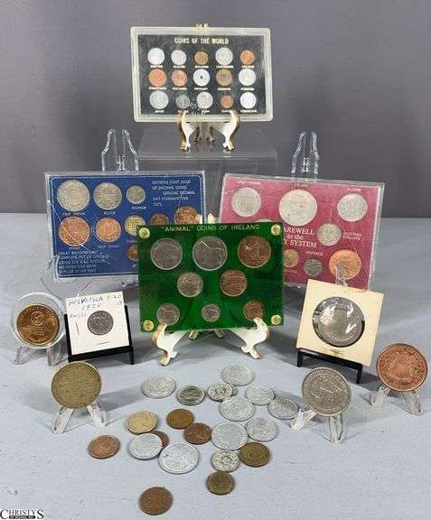 Foreign Coin Sets and Some Tokens.  Sets include Farewell to the L.S.D. System, "Animal" Coins of Ireland, Coins of the World, and Britains First Issue Coins. image