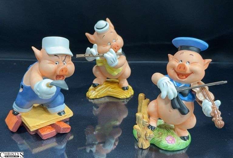 Walt Disney Classics Collection Three Little Pigs Sculptures in Boxes with Certificate of Authenticity.  Includes Fifer Pig "I Toot My Flute, I Don't Give a Hoot', Fiddler Pig "Hey Diddle, Diddle, I ply on my Fiddle" and Practical Pig "Work and Play Don't Mix" image