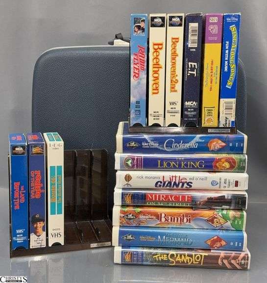 Assorted VHS Tapes and Small Suitcase image