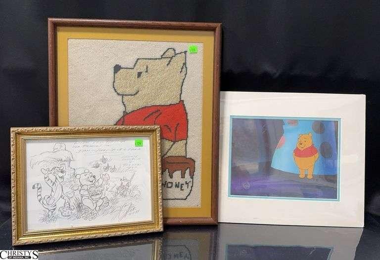 Unframed The New Adventures of Winnie The Pooh Production Cel  with a Photographic Reproduction Background with the Walt Disney Company Stamp. Approx. 17" X 14" Also included is a framed cross stitch Pooh and a Framed Winnie The Pooh and Tigger Too drawing image