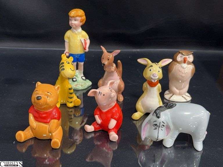 8 Piece Set of Beswick England Winnie The Pooh Characters.  Includes Christopher Robin, Winnie The Pooh, Tigger, Kanga, Owl, Eeyore, Piglet and Rabbit.  Tallest Approx. 5" image
