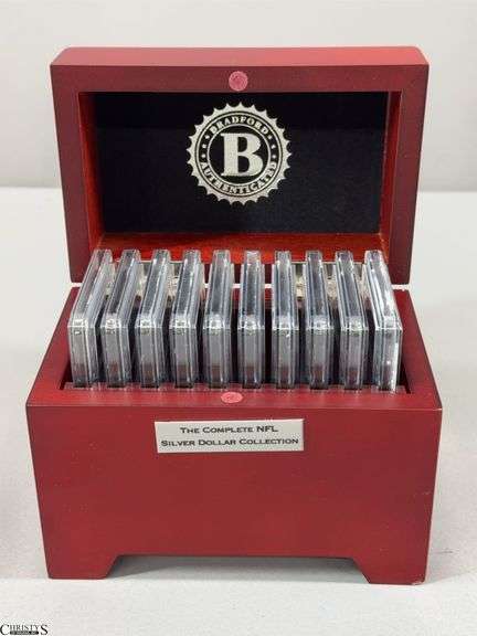 10 Piece NFL Silver Dollar Collection in Wooden Box.  Contains 10 2015 NFL BU Silver Dollars with Each Team's Logo in Official Team Color Plus It's Name and Year Established- Giants, Rams, Bengals, Lions, Broncos, Jets, Falcons, Vikings, Titans and Bills. image
