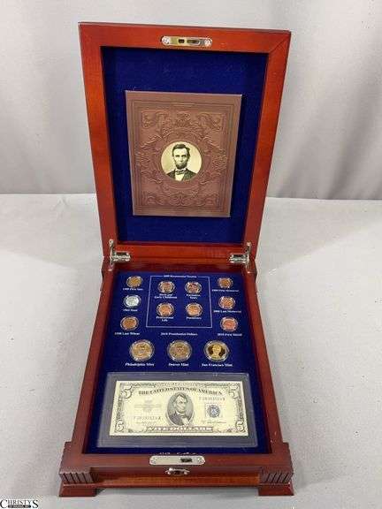 Abraham Lincoln Coin and Currency Collection in Wood Display Box.  Includes a 1953 Blue Seal $5 Silver Certificate, 3 $1 Coins and 10 One Cent Coins image
