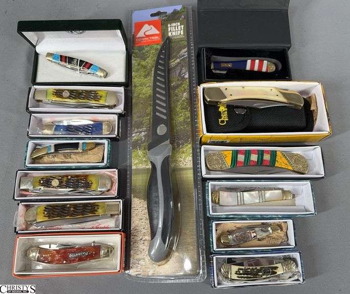 13 Pocket Knives in Boxes and 1 Ozark 6-Inch Fillet Knife New in Package.  Pocket Knife Brands include Frost, Marbles, Silverhorse Stoneworks and Cherokee Stone Works.  They look to be new. image