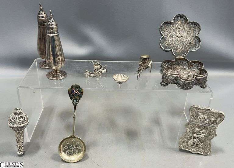 Sterling Silver Salt and Pepper, Sterling Miniature Shell and Miniature Rickshaw.  There are 6 other silver pieces that are unmarked (seller believes they are sterling silver) image