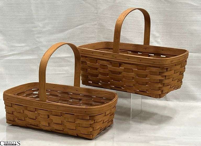 Two 1993 Longaberger Baskets with Fixed Handles.  One basket needs cleaned.  Approx 15"X 9" X 11" image
