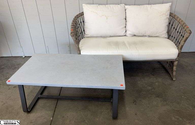 Resin Wicker Outdoor Settee and Metal Outdoor Coffee Table - 54" x 30" - 17" seat of settee, some staining to cushions image