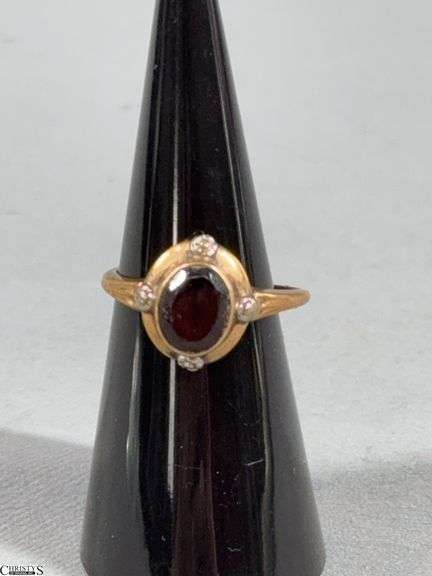 10K Yellow Gold Ring with a Brown/Red Center Stone.  This ring has been cut. image
