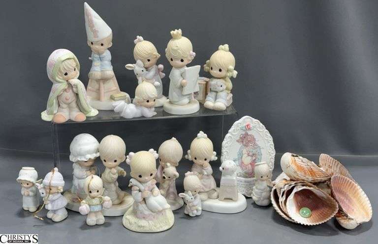 16 Precious Moments Figurines and 11 Shells.  Figurines include "Nobody's Perfect" Dunce, "Congratulations Princess", "Sew in Love", "Love Cannot Break a True Friendship" and Others image