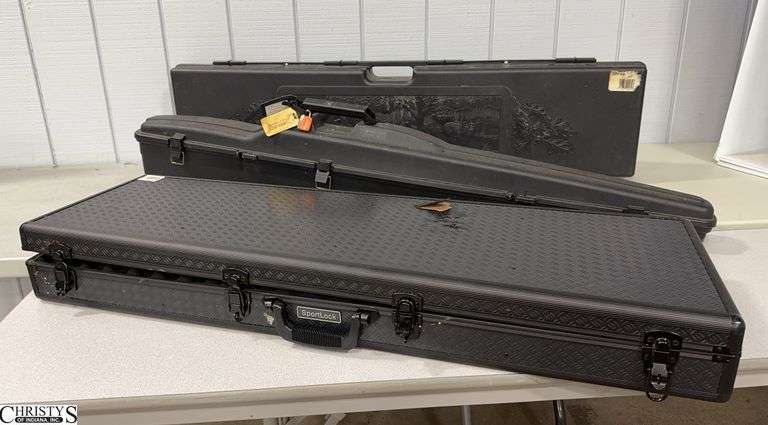 3 Hard Sided Black Gun Cases.  Includes a Sportlock and a Kolpin image