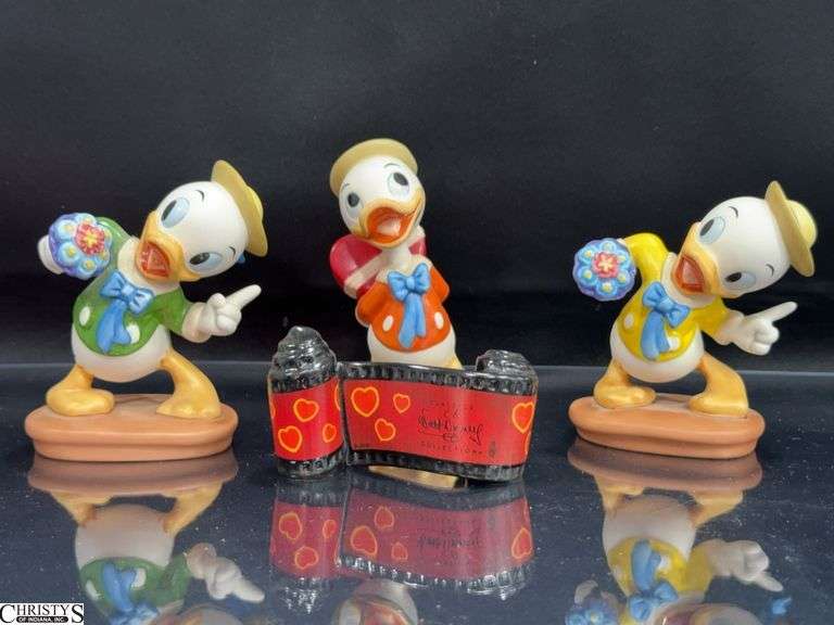 4 Walt Disney Classics Collection Donald Duck Sculptures in Box with Certificate of Authenticity.  Includes 1 Mr. Duck Steps Out "I Got Somethin' For Ya", Mr. Duck Steps Out Opening Title and 2 Mr. Duck Steps Out "Tag-Along Trouble" Louie image