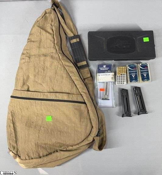 Approx. 103 CCI Cal. 22LR Cartridges, 2 Ruger 22 cal. Magazines, 1 S&W cal. 22LR Magazine, a Partial Gun Cleaning Kit and a AmeriBag Healthy Back Bag image