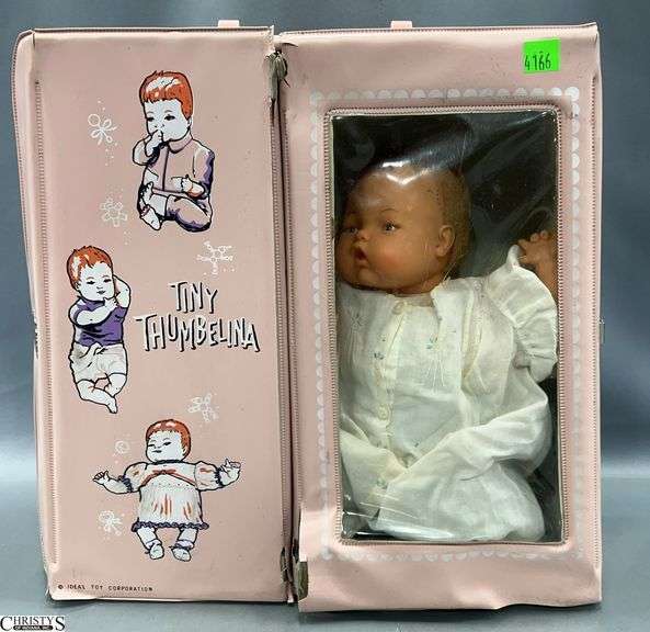 Thumbelina Doll and Case with Accessories.  The case and doll show wear and use. image
