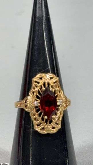 Ladies 10KT Yellow Gold Ring with 1 10x5mm Marquis Shape Garnet and 2 Approx. .01/100 RB Diamonds image