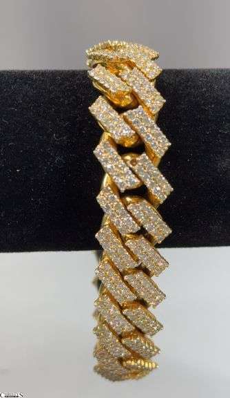 Yellow Gold and Diamond Bracelet.  Tests 10K and Diamond. Approx. 8" Long and 1/2" Wide.  There is 1 small diamond missing.  See Photo image