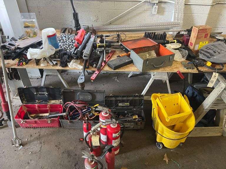 Assorted Tools and Parts on Table and Below image